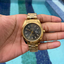 Rolex Dourado fundo preto